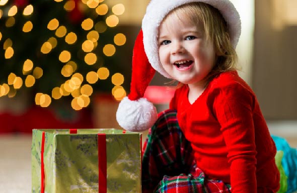 young girl with holiday present