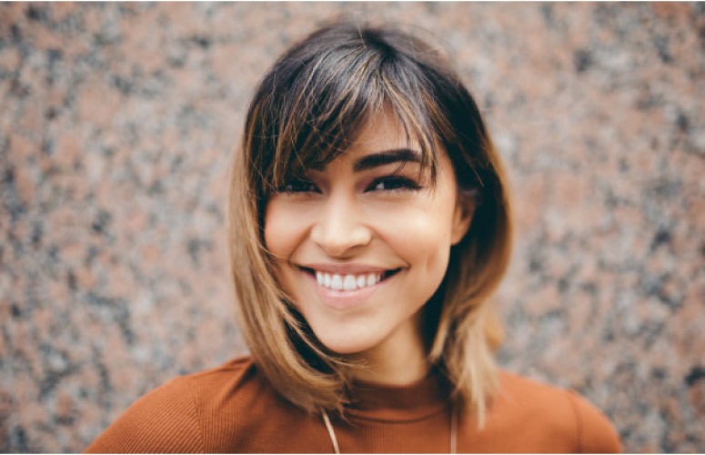 brown haired girl with a big smile