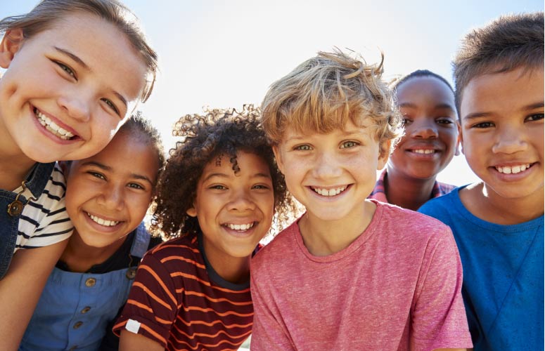 group of kids back to school smiling after completing dental checklist