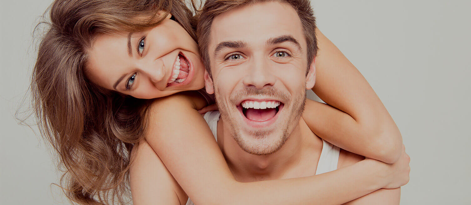 Woman on man's back smiling