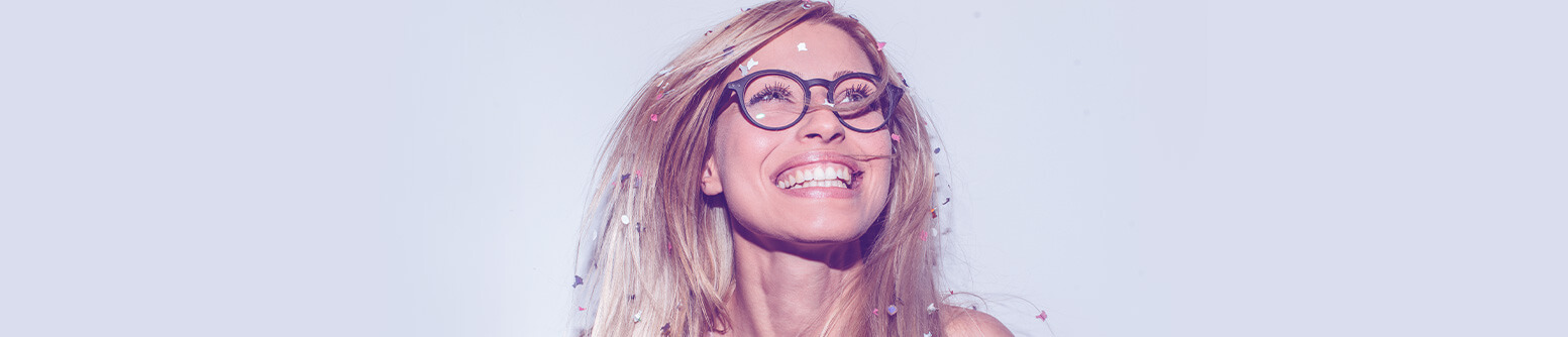 Woman with confetti smiling