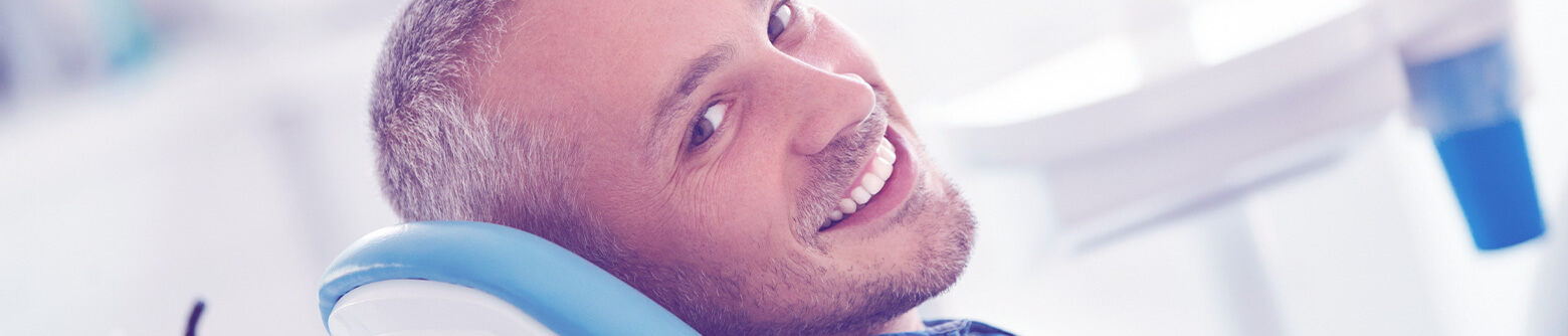 Man smiling in dental chair