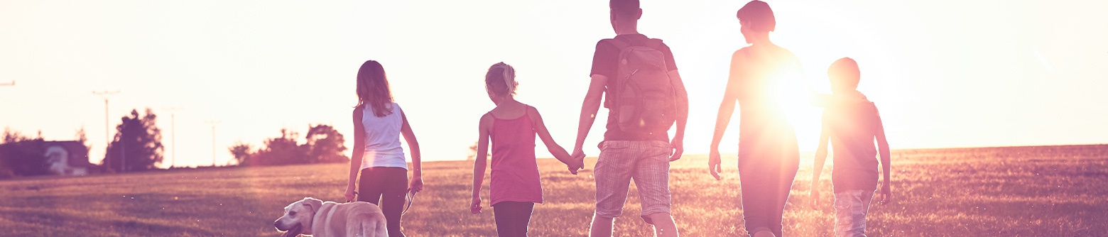 Family walking in field