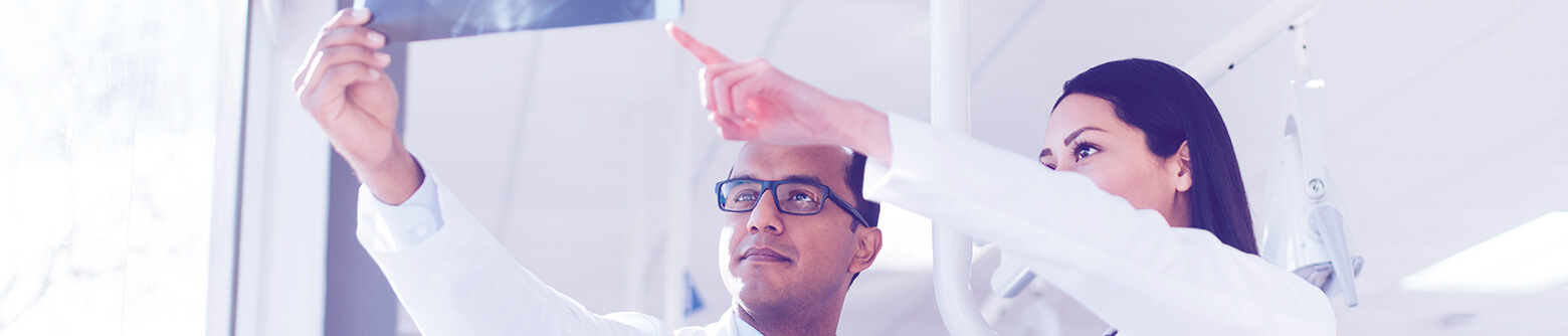 Dentists examining xrays