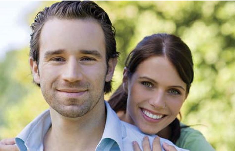 young couple smile after professional teeth whitening