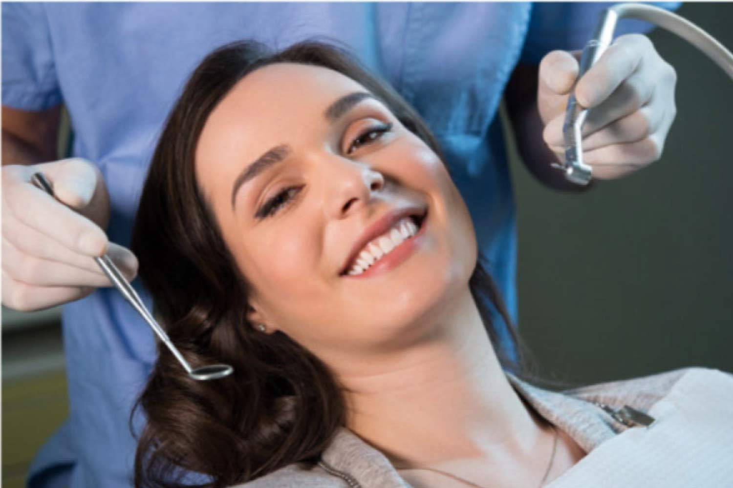 young woman gets a dental exam and cleaning