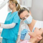 female dental patient getting a routine dental exam