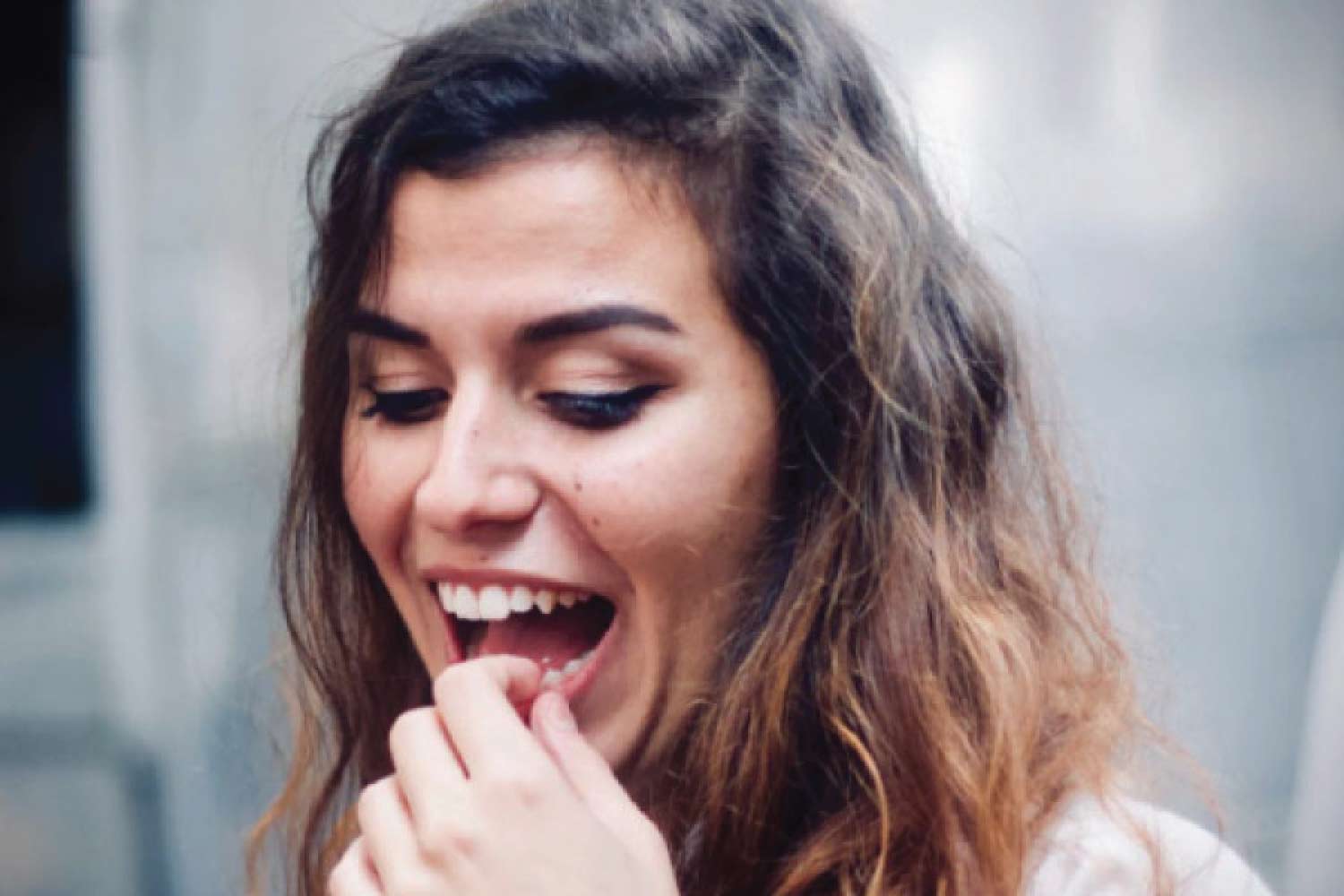 woman checks her tooth enamel