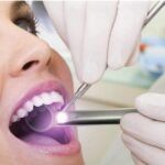 woman undergoing an oral cancer screening