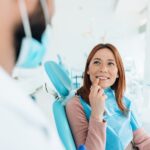woman discussing gum contouring with her dentist