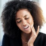 woman with toothache, types of toothaches